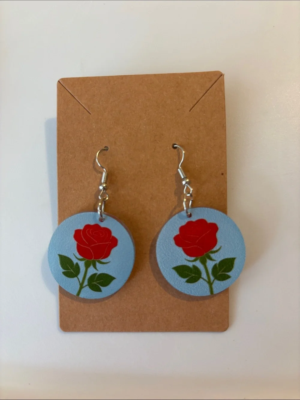 Fashion Jewelry Red Rose Earrings on Light Blue Discs